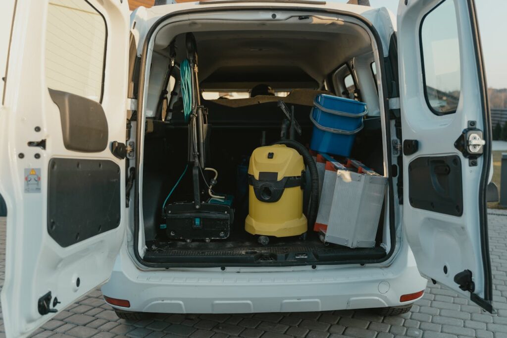 Van loading with commercial cleaning tools.