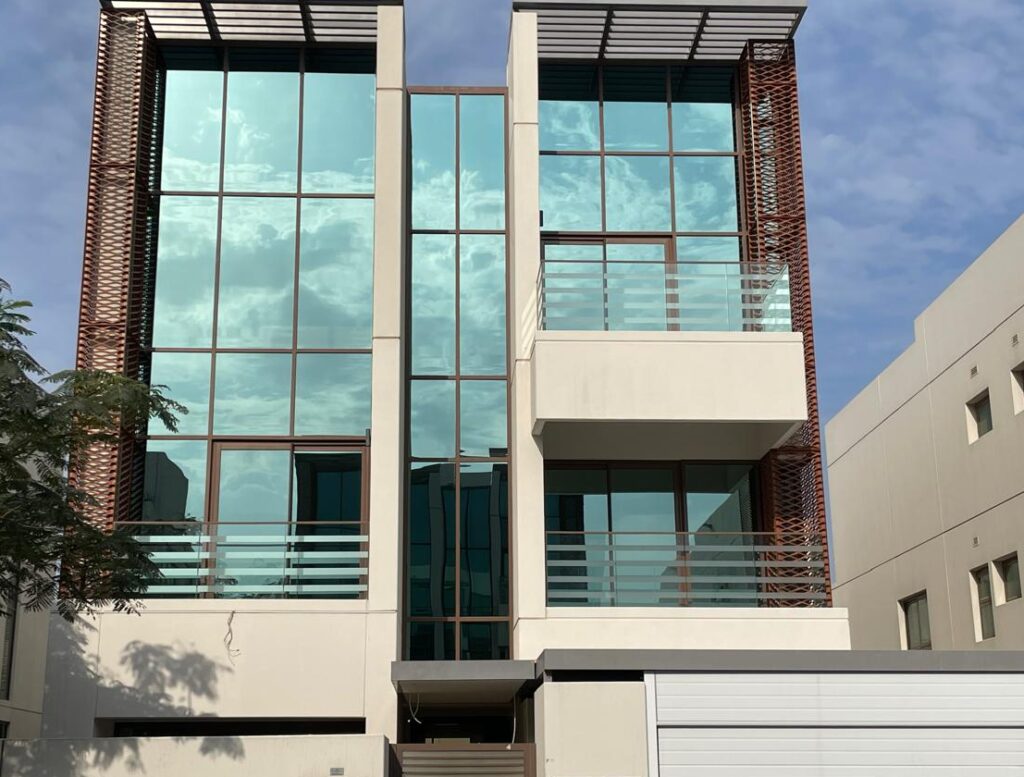 Front view of a luxury villa in Dubai Meydan after professional deep cleaning, with spotless glass, cleaned frames, and pressure-washed walls. professional deep cleaning services in Dubai