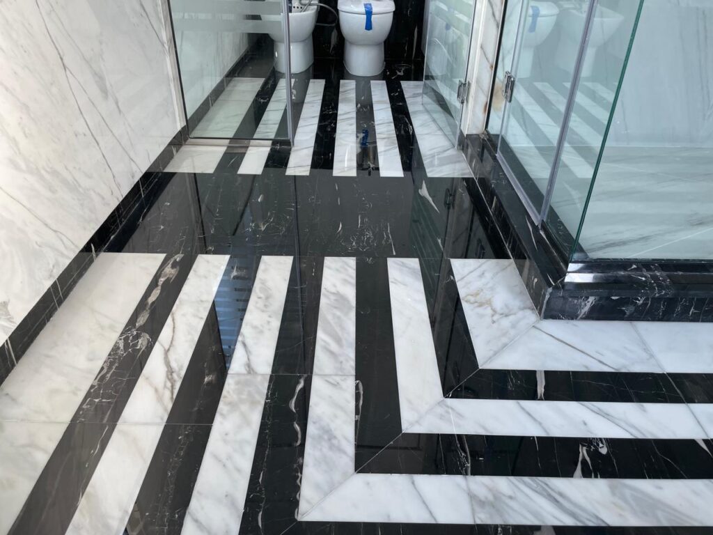 Black marble floor after restoration in Hattan Villa bathroom – marble floor maintenance Dubai