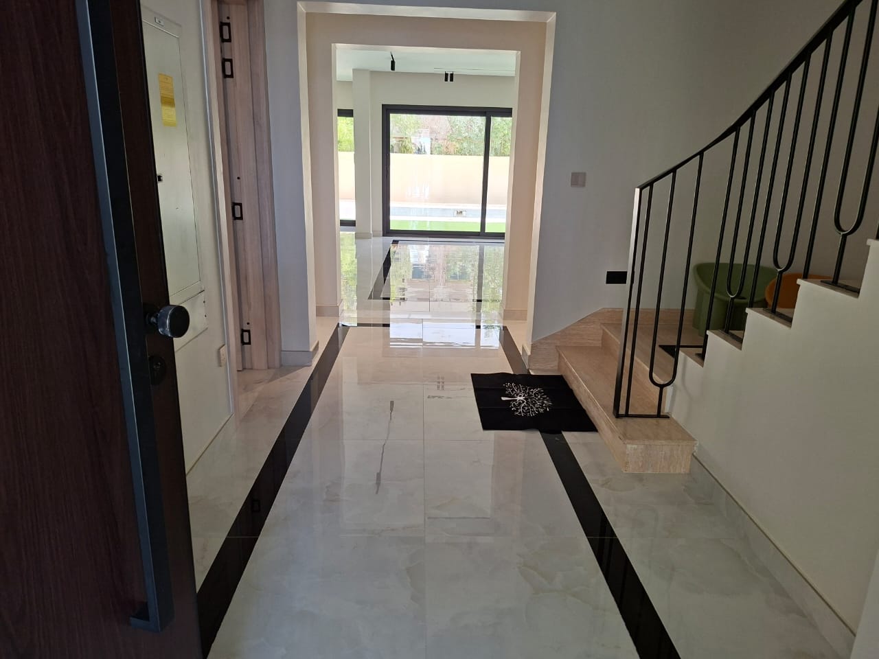 5 BHK villa living room after deep cleaning in JVT Dubai — glossy tiles and clear windows