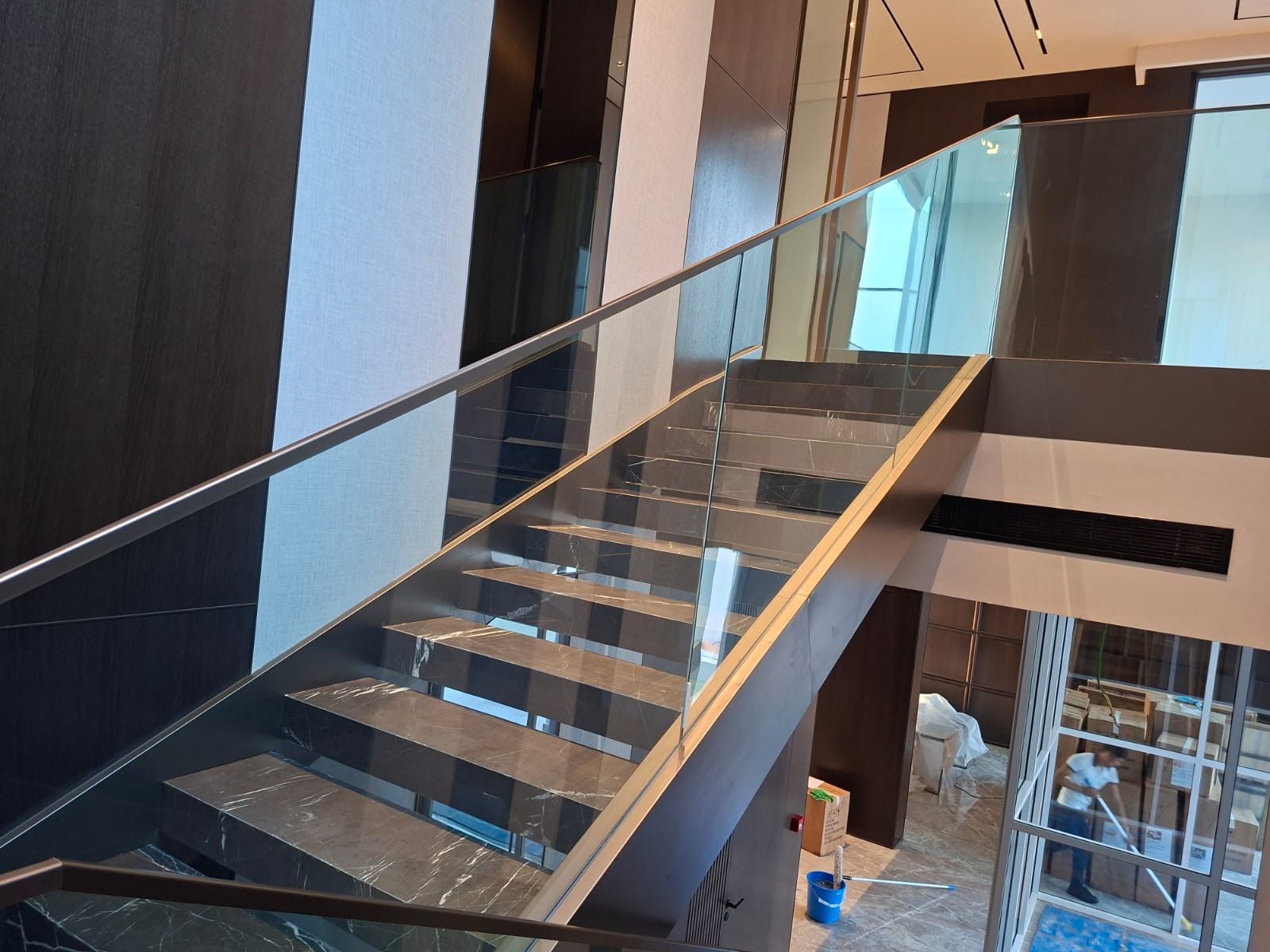 Luxury staircase detailing with clear glass balustrade Meydan