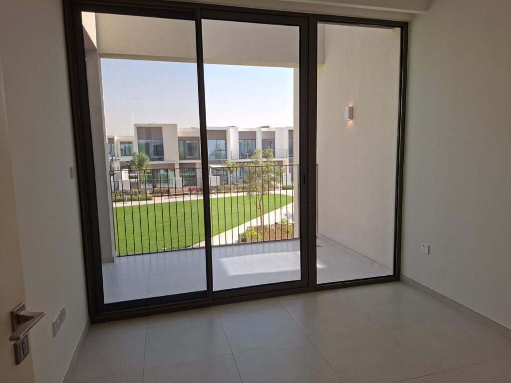 Bedroom balcony glass cleaning service at The Valley Nara community Dubai villa by Green Fresh Cleaning Services