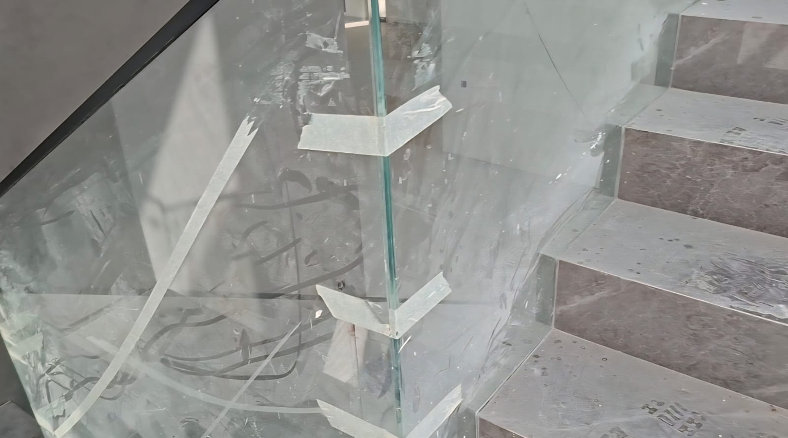 Before staircase glass cleaning